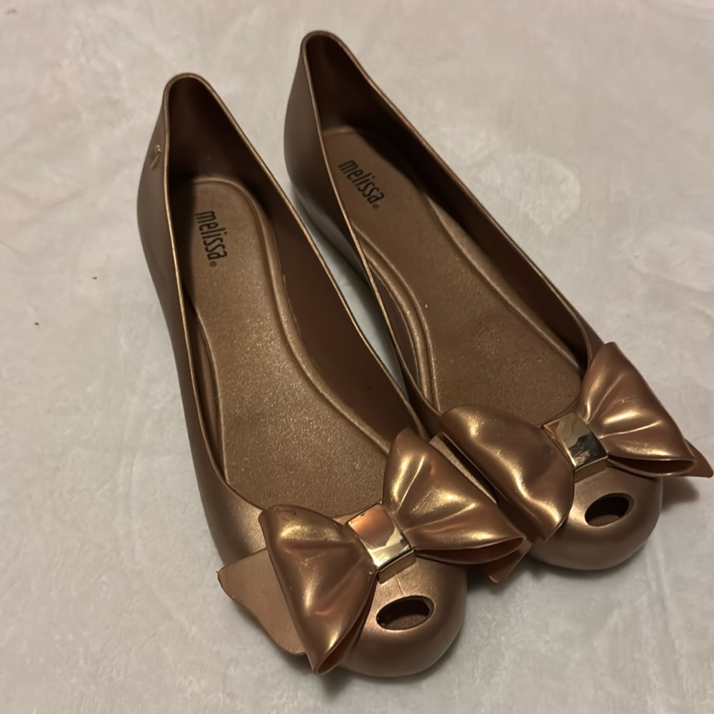 Gold Melissa flats smell so pretty very comfy.